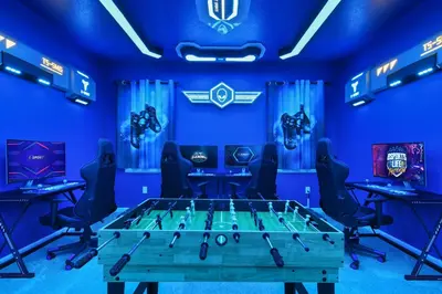 a raiders dressing room with a table and chairs at NEW Disney Themed 12BR Home Pool/SPA/Game/Tiki Bar in Kissimmee