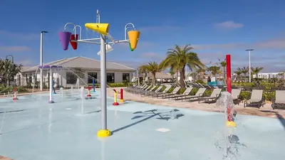 a pool with a water park with a basketball hoop at Disney-Themed Oasis with Private Pool & Spa in Kissimmee