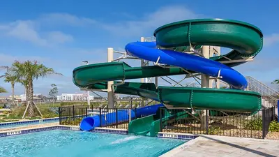 a water slide at a resort with a pool at Storey Lake Resort 6br Family Villa Pool by Disney in Kissimmee