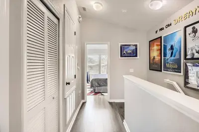 a hallway with a white door and a bedroom at T2501M Windsor Hills Resort 3Bedrm Private Pool in Orlando