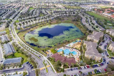 an aerial view of a park with a large lake at C2821-303 Windsor Hills Resort 3 Bedrm Water Park in Orlando