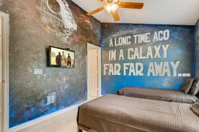 a room with a bed and a wall with a mural at T7676F Windsor Hills Resort 3Bed POOL Pet Friendly in Orlando