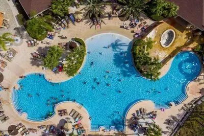 an overhead view of a pool at a resort at C7671-402 Windsor Hills Resort 2Bedrm Themed Condo in Orlando