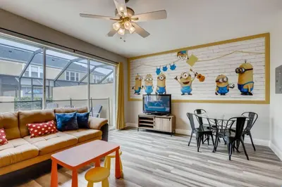 a living room with a couch and a table at T7674O Windsor Hills Resort 3Bedrm 2miles Disney in Orlando