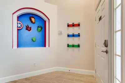a room with a window with legos on the wall at H8438S Emerald Island Resort One Level POOL Pet OK in Kissimmee