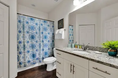 a bathroom with a toilet and a sink at 3206 Gold in Kissimmee