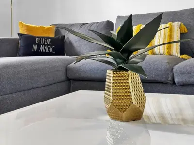 a vase on a coffee table in front of a couch at 3206 Gold in Kissimmee