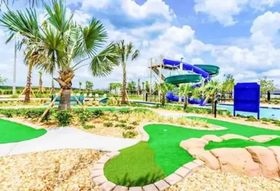 a miniature golf course at a resort with a slide at Magic Marvel Getaway in Kissimmee
