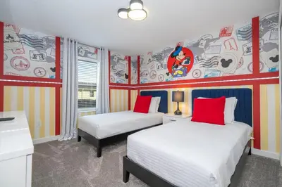 two beds in a room with colorful walls at Charming 4Bd w Private Pool @ Storey Lake Resort 2653 in Kissimmee