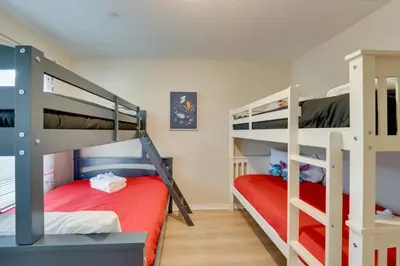 a bedroom with two bunk beds in a room at Haven Beautiful 3 BR TH in Gated Resort Community in Kissimmee