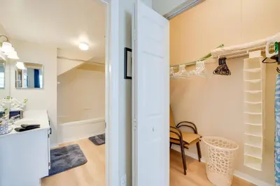 a room with a closet with shelves and a desk at Haven Beautiful 3 BR TH in Gated Resort Community in Kissimmee
