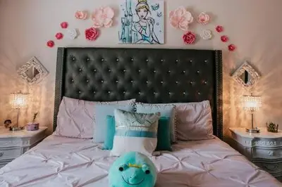 a bedroom with a large bed with a large headboard at Family house with amazing themed rooms in Kissimmee