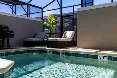 a swimming pool in the middle of a house at Amazing house near the parks in Kissimmee