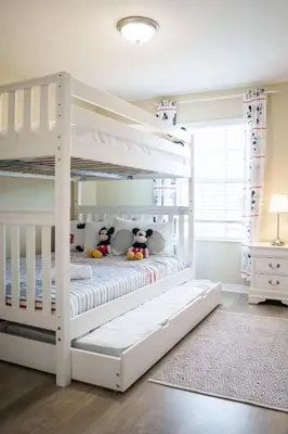 a white bunk bed with two stuffed animals on it at 9 min to Disney w Pool- 4BD 3BA - FREE Waterpark in Kissimmee