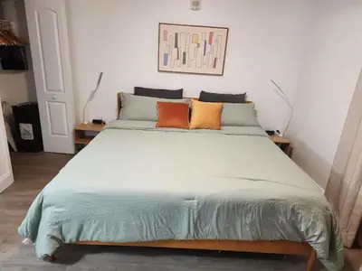 a bedroom with a large bed with four pillows at Orlando 3rd Floor - Blue Heron in Orlando
