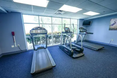 a gym with two exercise bikes in a room at Orlando 3rd Floor - Blue Heron in Orlando