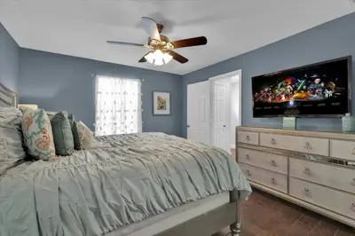 a bedroom with a bed and a ceiling fan at 7752 Tosteth in Kissimmee