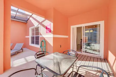a room with a table and chairs on a balcony at Resort Perks and Private Pool Kissimmee Retreat! in Kissimmee