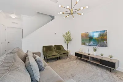 a living room with a couch and two chairs at Cozy 4Bedrooms At Lucaya- 7 miles from Disney in Kissimmee
