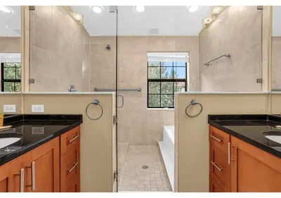 a large bathroom with a shower and a sink at Your Summer Getaway Awaits - Townhome by Disney! in Orlando