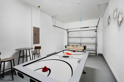 a kitchen with a ping pong table in a room at 2920 Banana Palm in Kissimmee