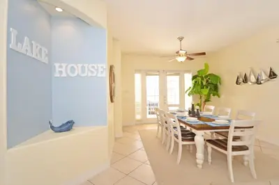a dining room with a table and chairs at Lake House at Formosa home in Orlando