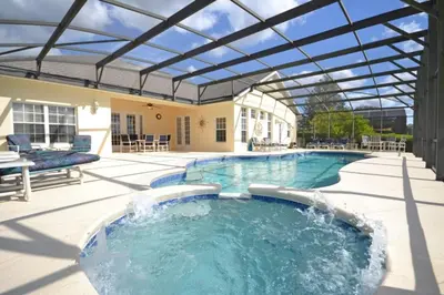 a large swimming pool with a glass roof at Lake House at Formosa home in Orlando