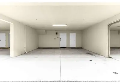 an empty room with white walls and white doors at Summer Deal - Relax & Unwind, Townhome by Disney! in Orlando