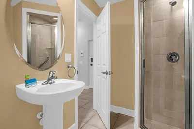 a bathroom with a sink and a shower at Sunny Summer Awaits - Renovated Townhome by Disney! in Orlando