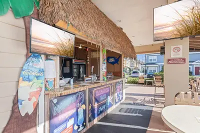 a fast food restaurant with a counter with signs on it at The Villas at Seven Dwarfs - 4564 Luxury Villa - Near Disney - Water Park in Kissimmee
