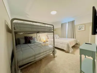 a bedroom with two bunk beds and a table at Modern 3BR3BA Home at The Hub Reserve in Kissimmee