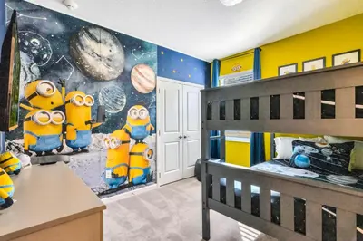 a childs room with a minion mural on the wall at BV310MB - Disney & Universal heroes - 16 guests in Kissimmee