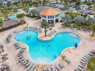an overhead view of a swimming pool at a resort at StoreyLake Disney Pool Home, Lake View, By Disney in Kissimmee