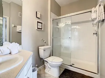 a bathroom with a toilet and a shower and a sink at Windsor Hills Mickey Mouse Condo, 2.5mi Disney in Orlando