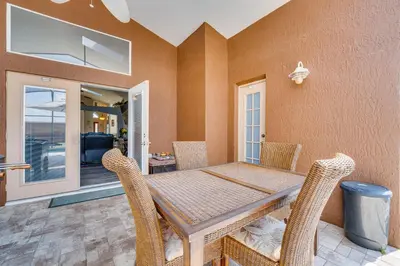 a dining room with a table and chairs at 4 Mi to Disney Spacious Retreat with Pool and Yard! in Kissimmee
