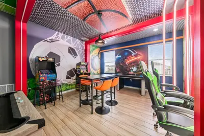 a gaming room with a table and chairs at Big Family Home with Game Room Sleeps 28 BLV104 in Kissimmee