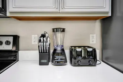a kitchen counter with a blender and other appliances at Comfy House at Compass Bay CB102 in Kissimmee