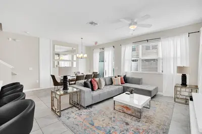 a living room with a couch and a table at Comfy House at Compass Bay CB102 in Kissimmee