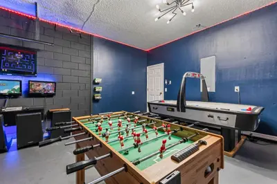 a game room with a foosball table and a pool table at 7BDM Prvt Pool Villa - Gated Resort 10min to Disney in Kissimmee