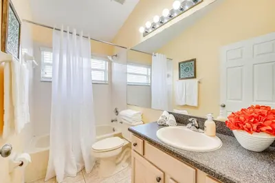 a bathroom with a sink and a toilet and a shower at Renovated Kissimmee Home - 10 Mi to Disney Springs in Kissimmee