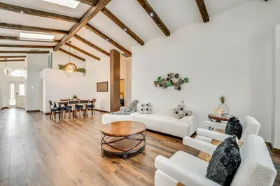 a living room with white furniture and a table at Renovated Kissimmee Home - 10 Mi to Disney Springs in Kissimmee