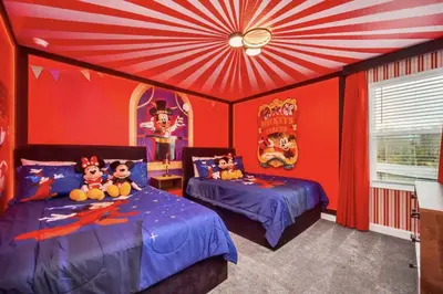 a bedroom with two beds and a red ceiling at Amazing 9 Bedroom Lake View in Kissimmee