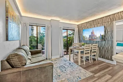 a living room with a couch and a table at Exclusive Ground floor Apartment with Balcony in Orlando