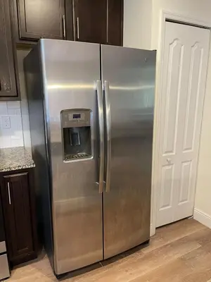 a stainless steel refrigerator with a water dispenser on it at Resort-Style Home in gated community with ammenities close to MCO and Parks! in Kissimmee