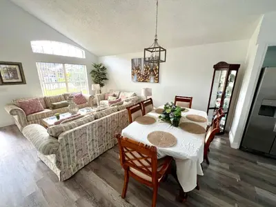a living room with a couch and a table at Buena Ventura Escape in Kissimmee