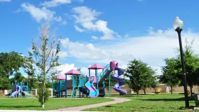 a playground with a slide in a park at Shvck3 - Coral Cay Resort #3 - 4 Bed 3 Baths Townhome in Kissimmee