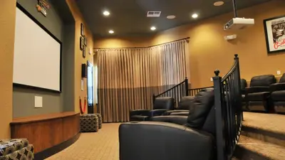 a movie room with chairs and a screen at Shvck4 - Coral Cay Resort #4 - 4 Bed 3 Baths Townhome in Kissimmee