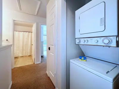 a white laundry room with a washer and dryer at Lovely Family Town home in Great Location townhouse in Kissimmee