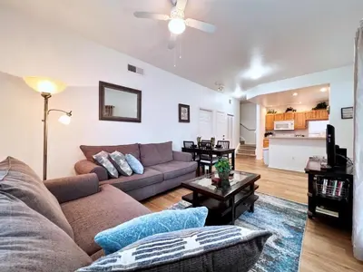 a living room with a couch and a table at Lovely Family Town home in Great Location townhouse in Kissimmee