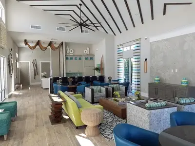 a large living room with couches and chairs at Beautiful Renovated 6 Bed Pool Home home in Kissimmee